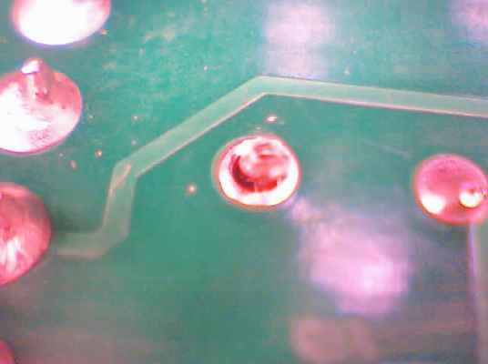 Broken solder joint on capacitor lead to PCB.